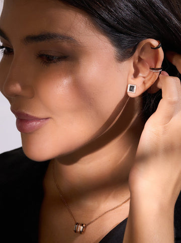 A pair of Earrings - Black Enamel with diamonds