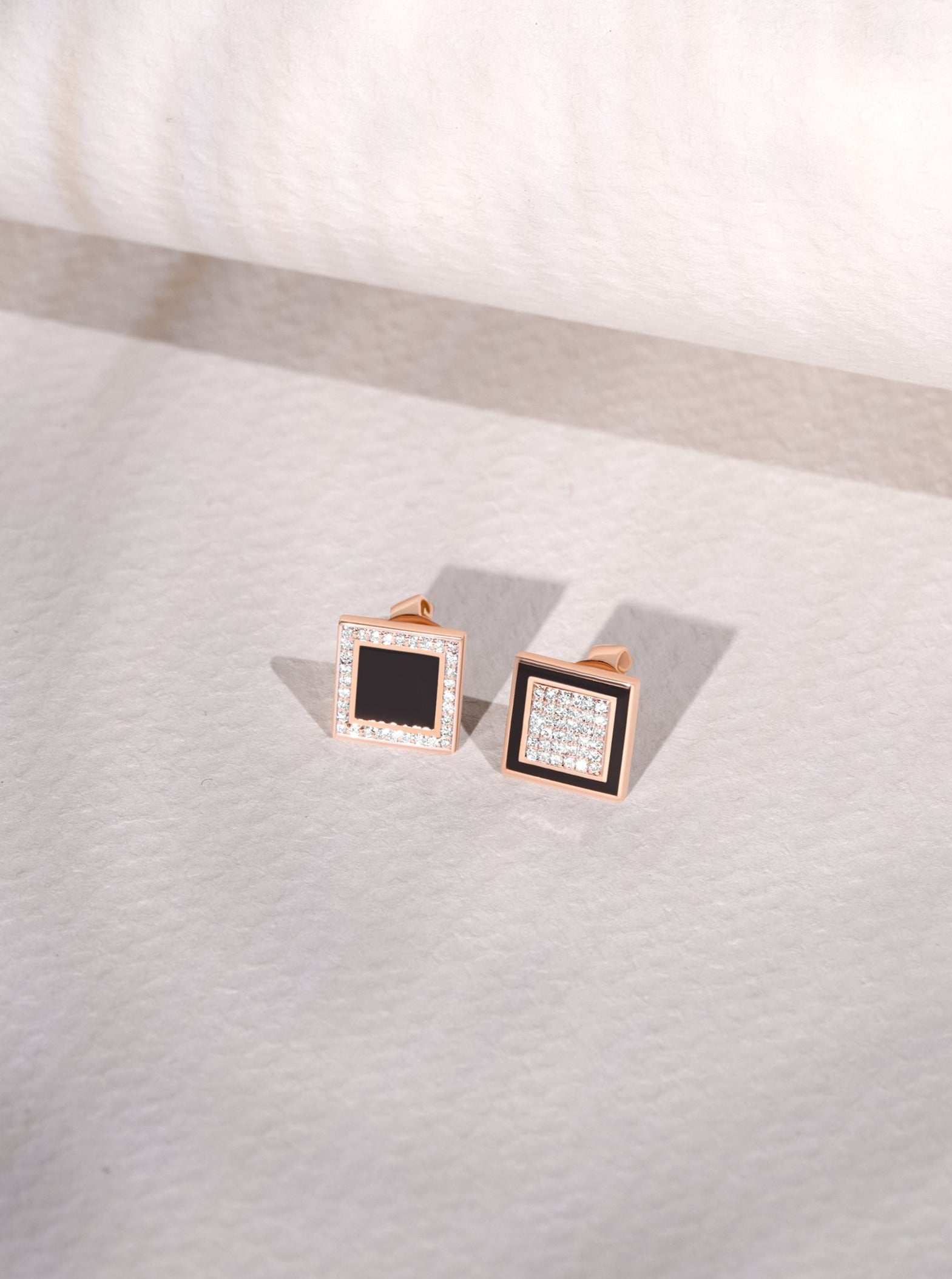 A pair of Earrings - Black Enamel with diamonds