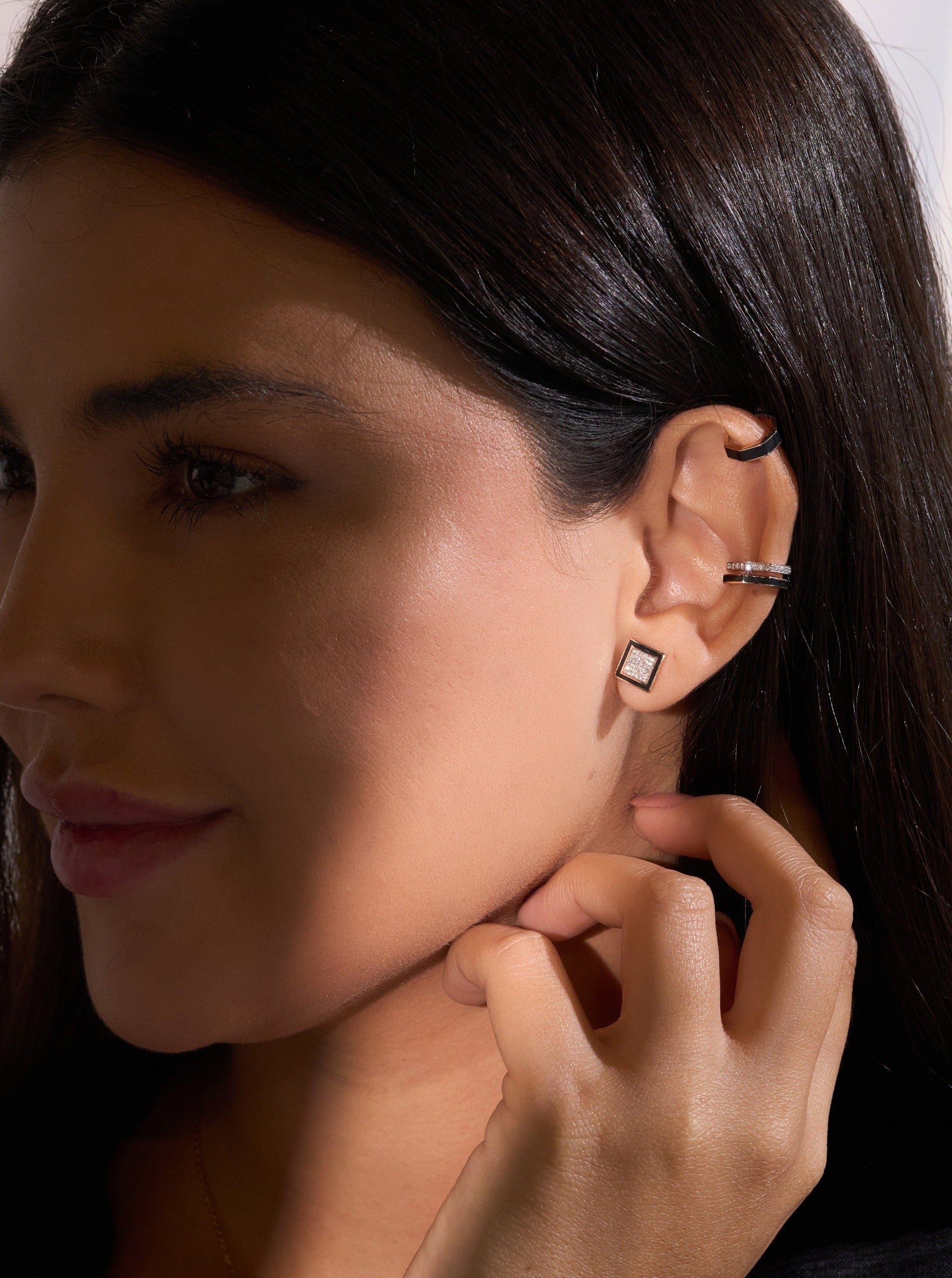 A pair of Earrings - Black Enamel with diamonds